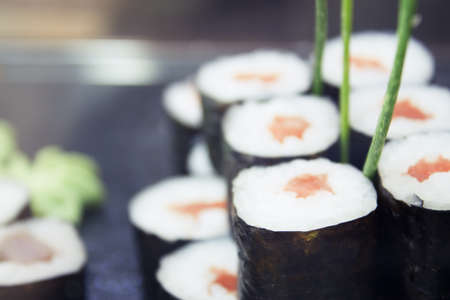 Assorted sushi food on a black slate plate. No peopleの写真素材