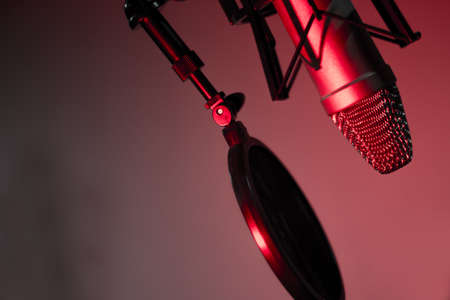 Professional microphone suspended in the air of professional studioの写真素材