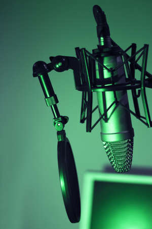 Professional microphone suspended in the air of professional studioの写真素材