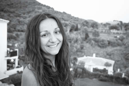 Portrait of young woman on mountain background. Smiling.の写真素材