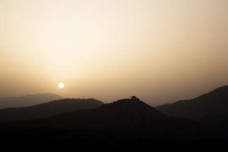 Sunset in the mountains with the sun. not peopleの写真素材