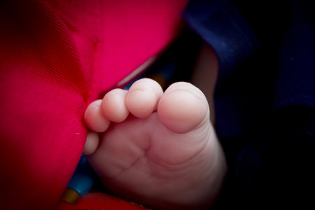 Two month old baby feet on black background. sweet-sceneの写真素材