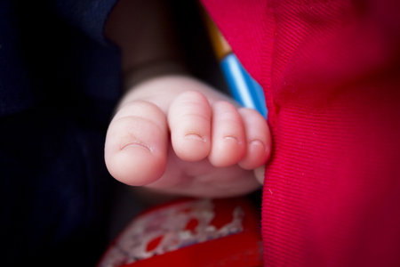 Two month old baby feet on black background. sweet-sceneの写真素材