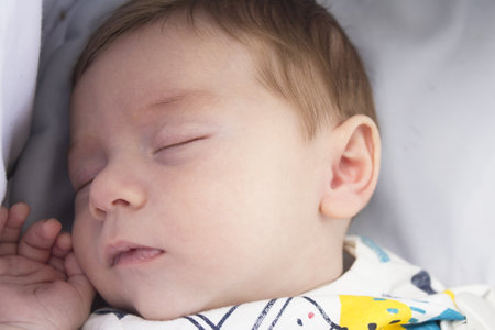 Sleeping two month old baby. Close your eyes.の写真素材
