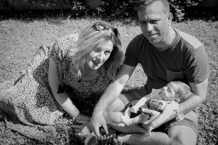 Family sitting on the grass. summer dayの写真素材