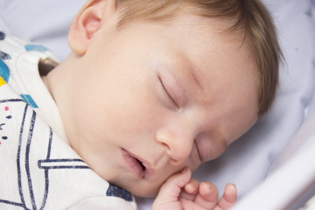 Sleeping two month old baby. Close your eyes.の写真素材