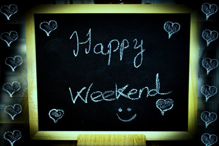 Happy weekend written with chalk. No copy spaceの写真素材