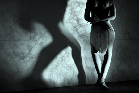 Woman with green dress dancing latin danceの写真素材