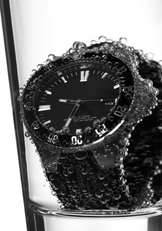 a glass with a clock insideの写真素材