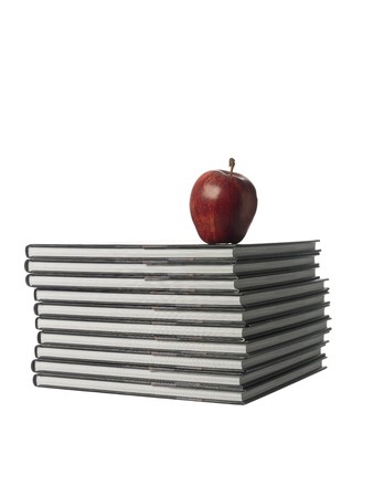 pile of books with a appleの写真素材