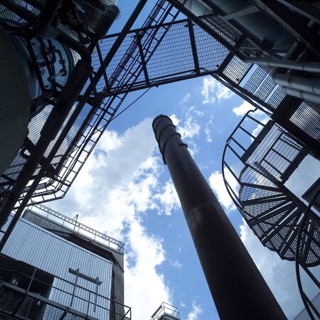Chimney against a blue skyの写真素材