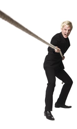 Boy pulling a ropeの写真素材