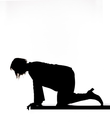 Silhouette of a woman looking downの写真素材