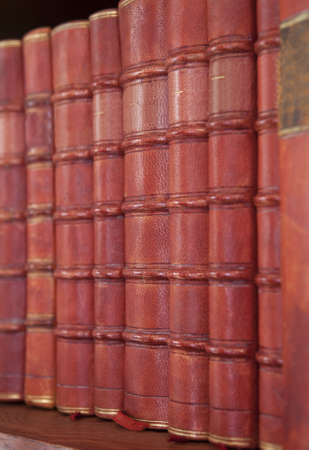 Antique books in a rowの写真素材