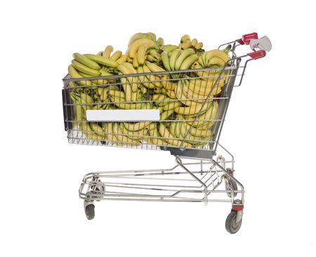 Shopping cart with bananas isolated towards white backgroundの写真素材