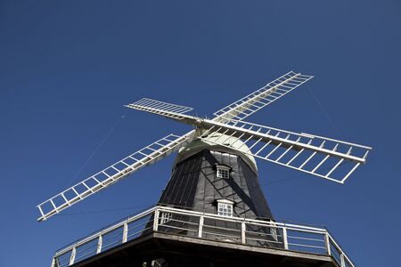 Windmill towards blue skyの写真素材