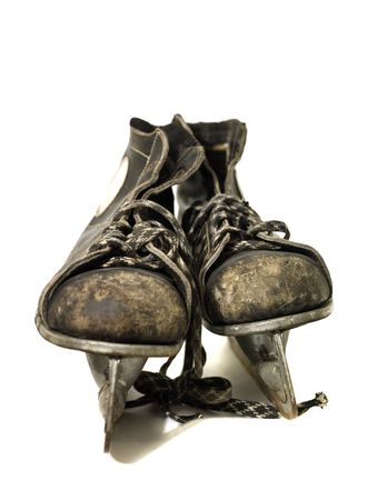 Worn ice-skates isolated on white backgroundの写真素材