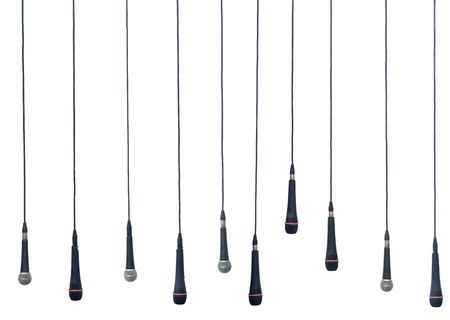 Isolated microphones in a rowの写真素材