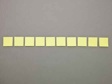 Yellow Adhesive Notes in a row