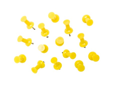 Yellow Pushpins isolated on white backgroundの写真素材