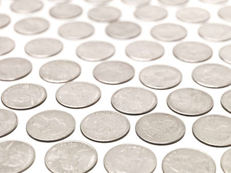 Arranged Quarter coins on white backgroundの写真素材
