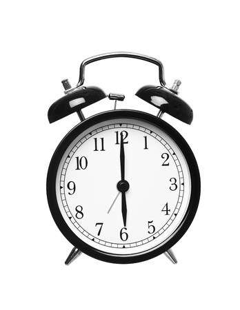 Alarm clock shows six o`clock isolated on white background Alarm clock shows six o`clock isolated on white background