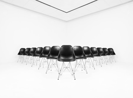 Black chairs isolated in a white roomの写真素材