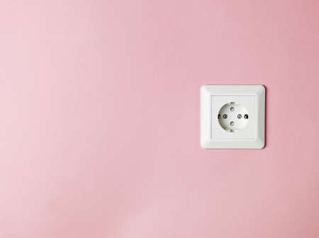 Electric Contact on pink backgroundの写真素材