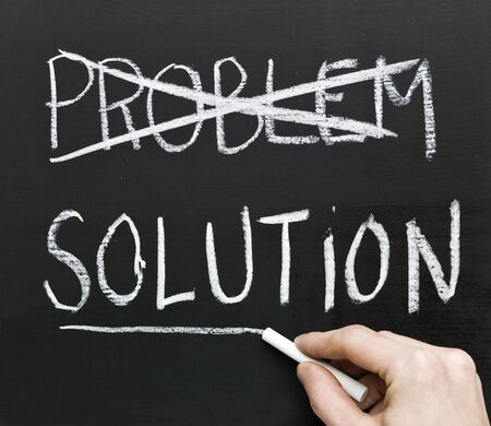 The word solution on a blackboardの写真素材