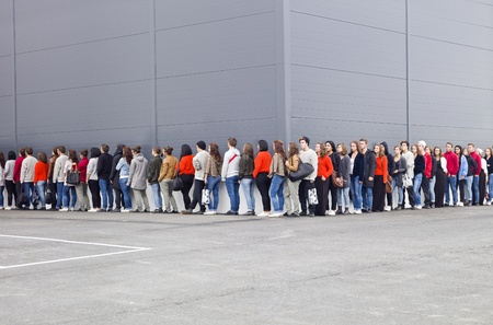 Large group of people waiting in line