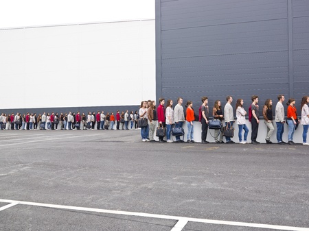 Large group of people waiting in line