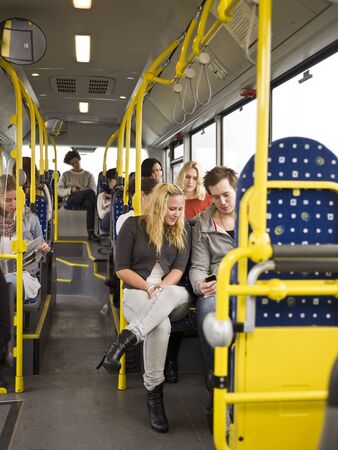 Large group of People going by busの写真素材