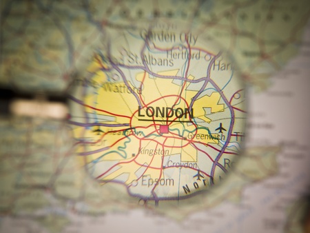 Magnifying Glass in front of a London mapの写真素材