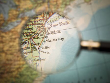Magnifying Glass in front of an Atlantic City mapの写真素材