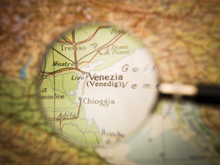 Magnifying Glass in front of a Venice mapの写真素材