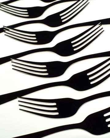 Silhouette of forks isolated on white backgroundの写真素材