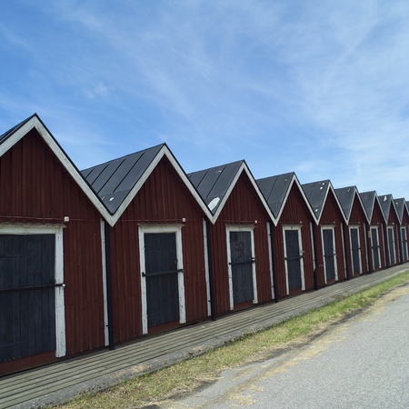 Row of boathouses on a sunny dayのeditorial素材