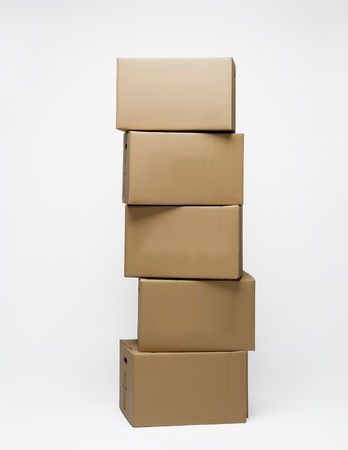 Stack of Cardboard Boxes isolated on white backgroundの写真素材