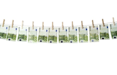 Laundering money towards white backgroundの写真素材