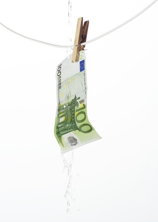 Laundering money towards white backgroundの写真素材