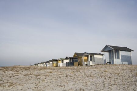 Beach Huts in a row close to waterの写真素材