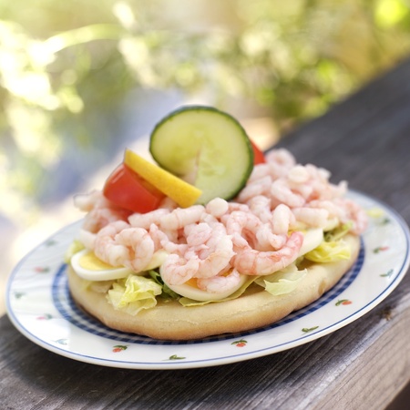 Prawn sandwich on a plate outdoorの写真素材