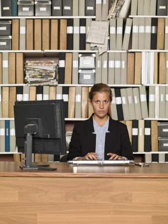Serious Businesswoman in a clean officeの写真素材