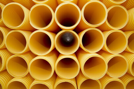 Yellow plastic pipes full frameの写真素材