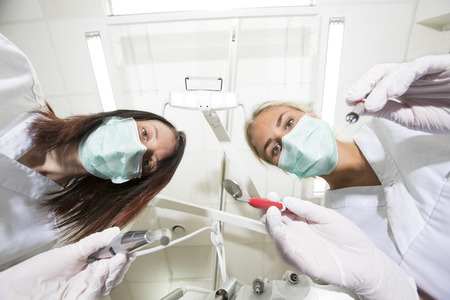 Dentist and nurse from low angle viewの写真素材