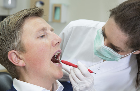 Female Dentist and Male patientの写真素材