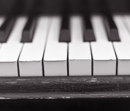 Close up of worn Piano Keysの写真素材