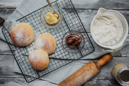 Close up view of bakers are working. Homemade bread. Hands preparing dough on wooden table.