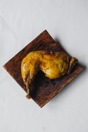 Ayam Goreng Bumbu Kuning or Fried Chicken Yellow Spices, One of Indonesia's cullinary icons with white background and top view.の写真素材
