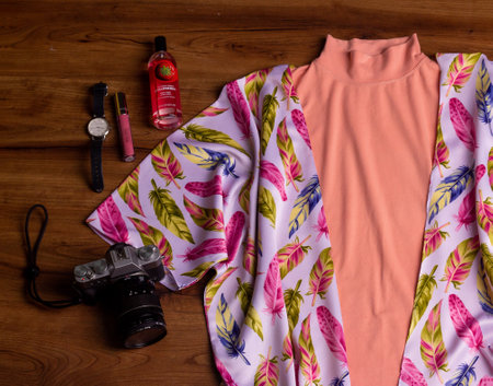 Colourful women wardobe for daily wear or formal outfit. With summer concept. Outwear on the hanger on the wooden background. Able to add some text or another objectの写真素材
